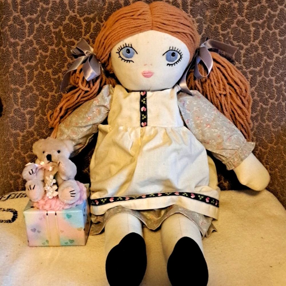 Soft body doll and music box